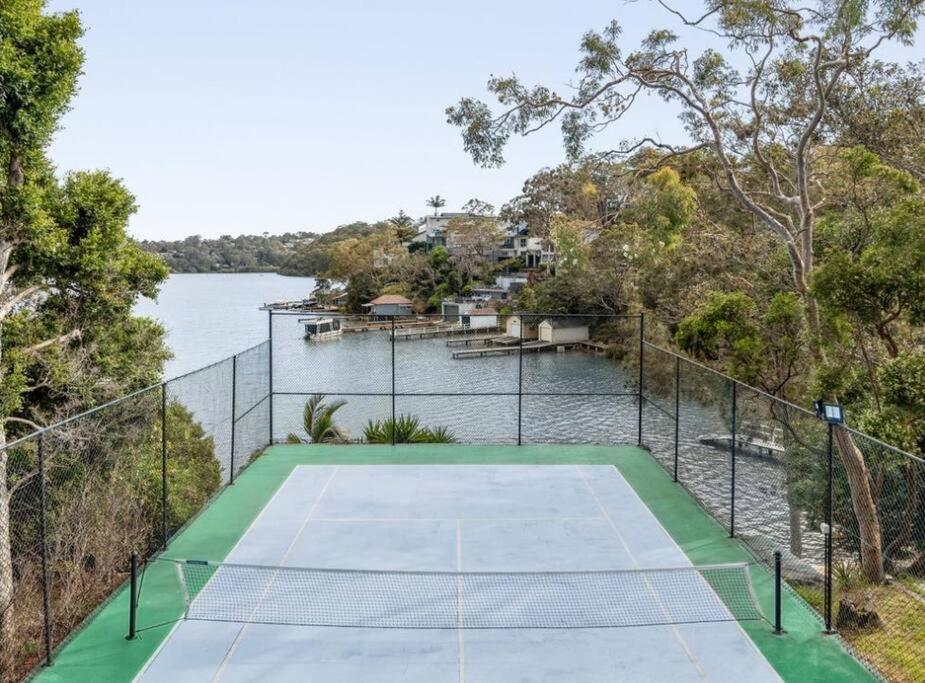 Luxurious Waterfront Retreat with Tennis Court
