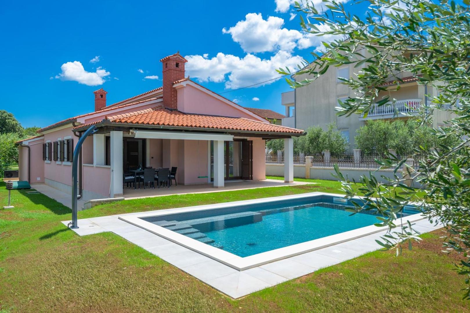 Olive tree oasis with heated pool view 3