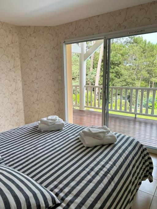 Villa Luxe piscine chauffée, 4 chambres, surplombant le golf entre océan & lac Plage à 5 min