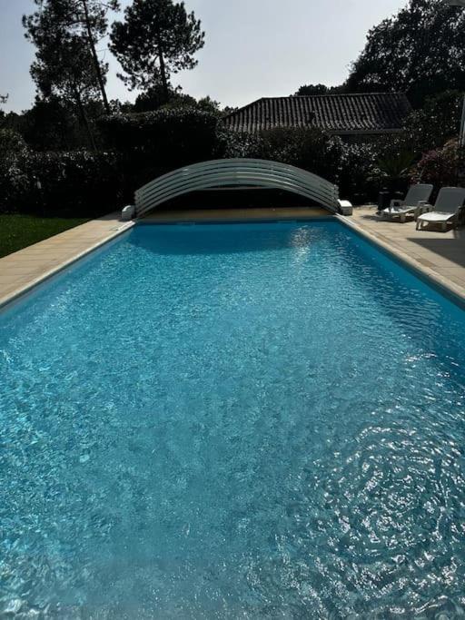 Villa Luxe piscine chauffée, 4 chambres, surplombant le golf entre océan & lac Plage à 5 min