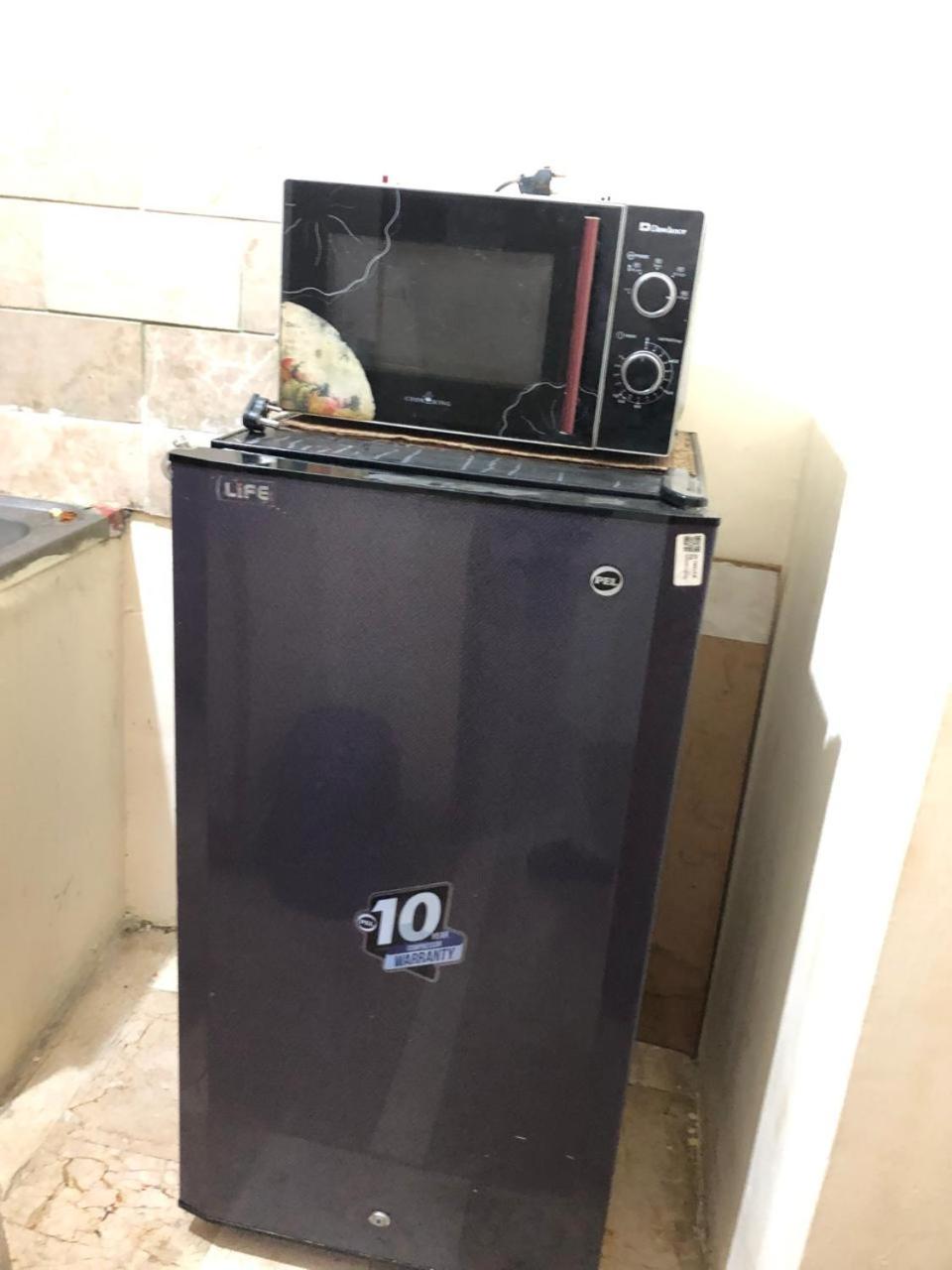 F-10 two bed Posh Apartment lounge kitchen AC WiFi smart Tv view 2