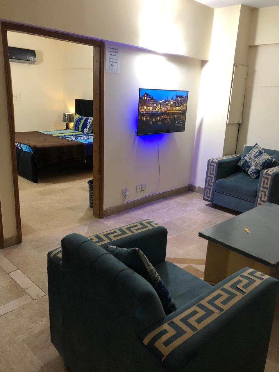 F-10 two bed Posh Apartment lounge kitchen AC WiFi smart Tv view 3