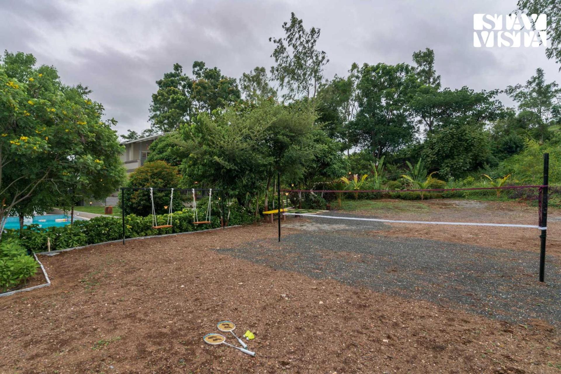 StayVista at Amber & Mist - Pool and Lawn view 3