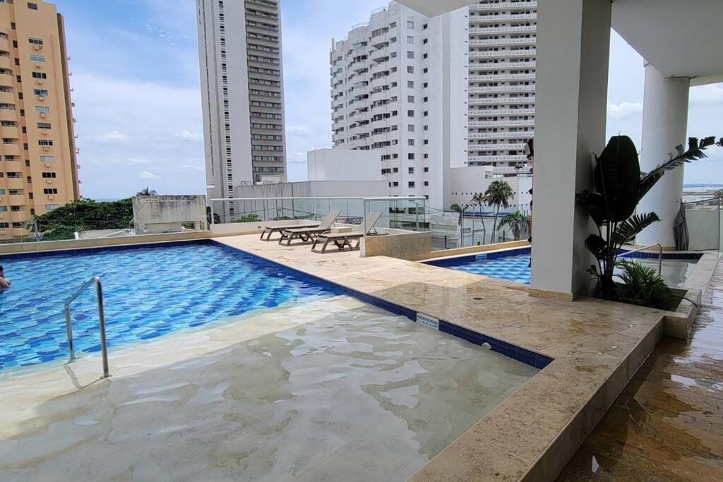 Stunning Infinity Pool, Balcony, steps from Walled City & Marbella Beach