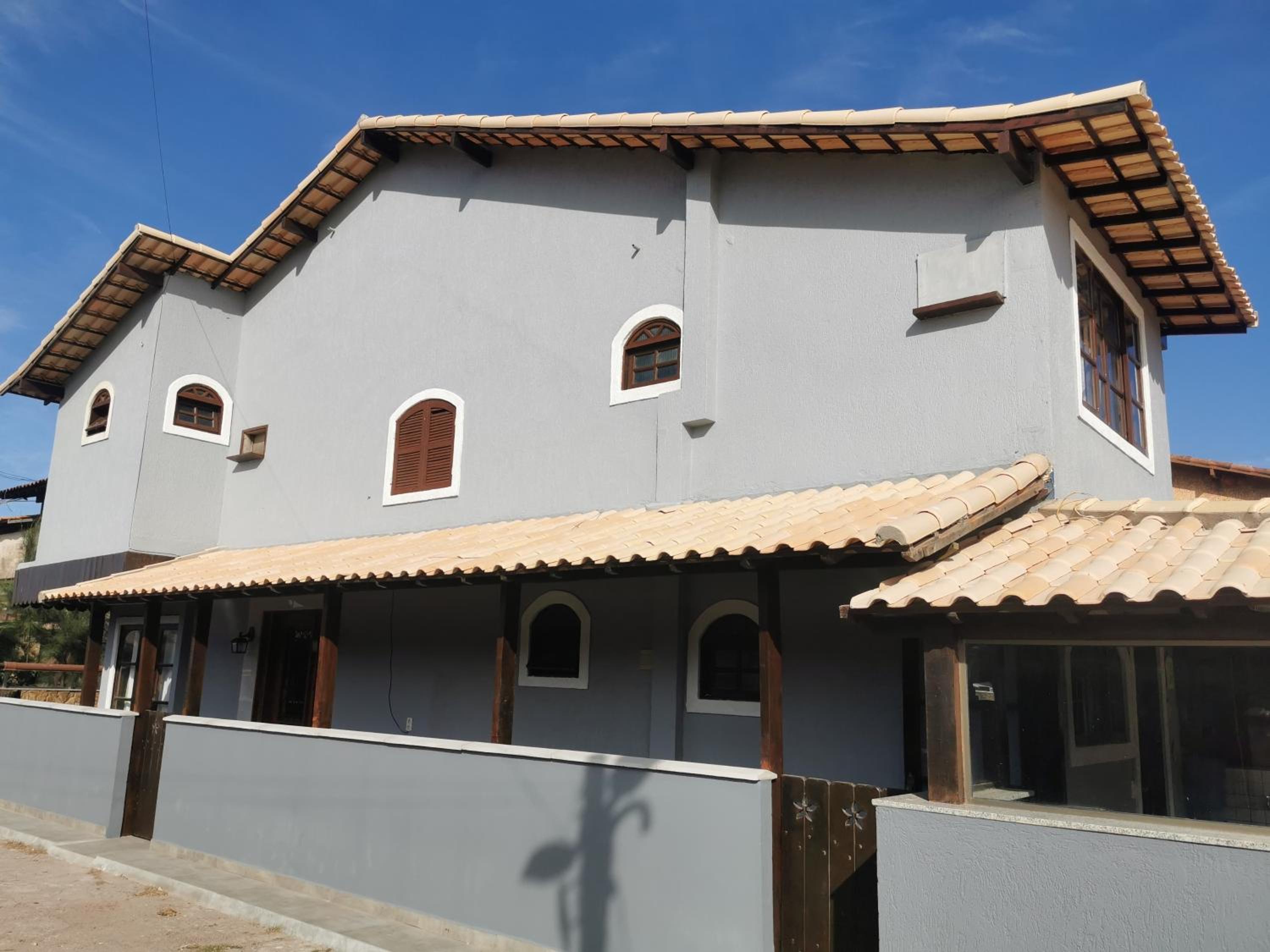 Casa Azul na Praia do Verão Vermelho