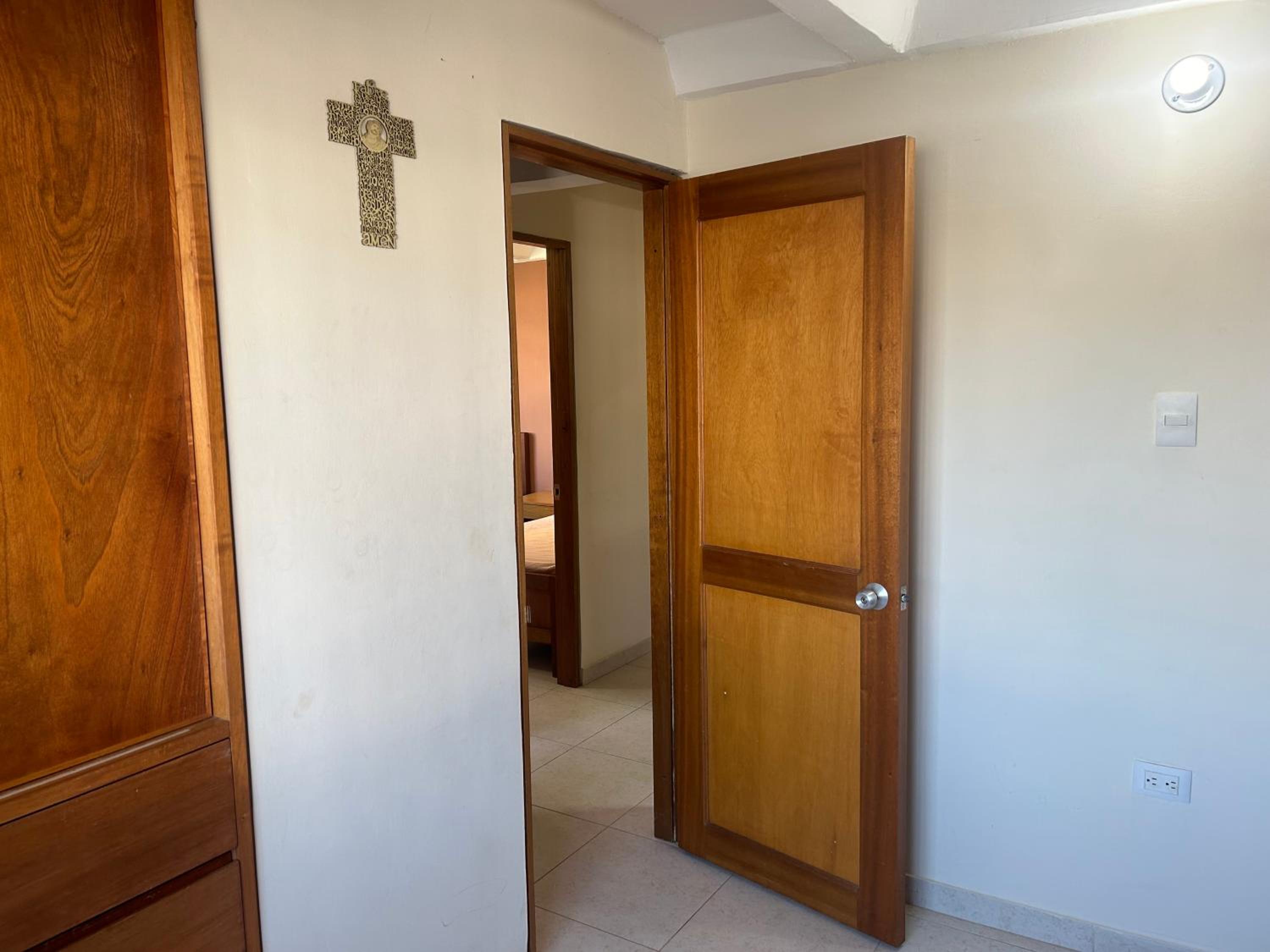 La Suite Caribeña Room with a bunk bed and private bathroom with a fan