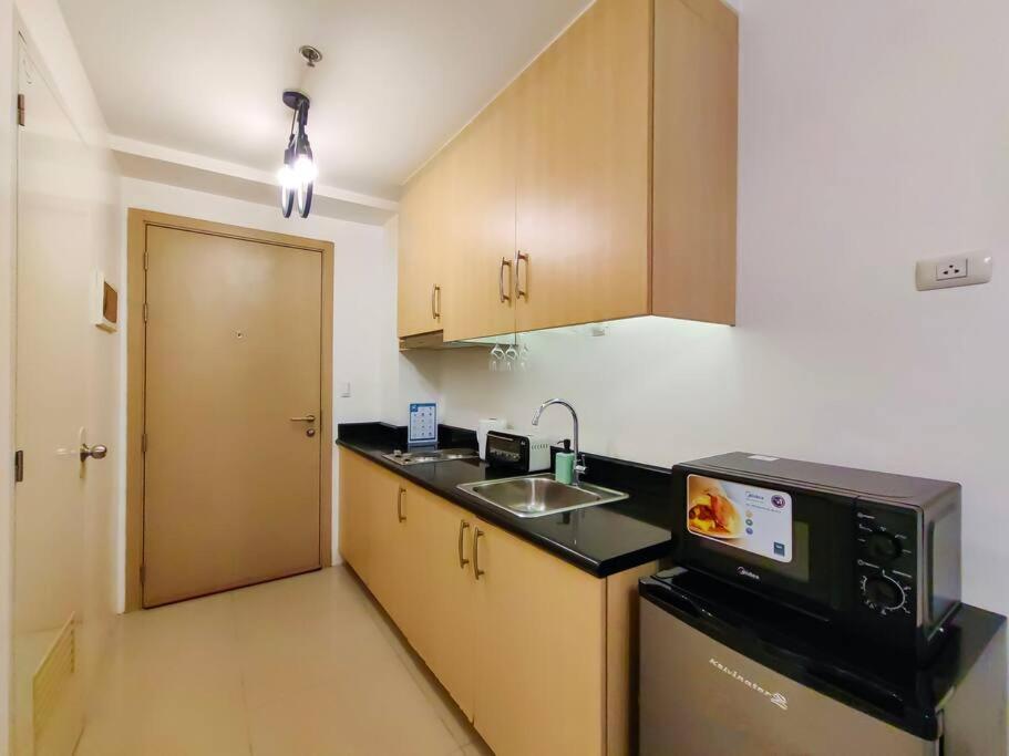 1BR Condotel with Balcony at SM Light Residences #LT02 view 2