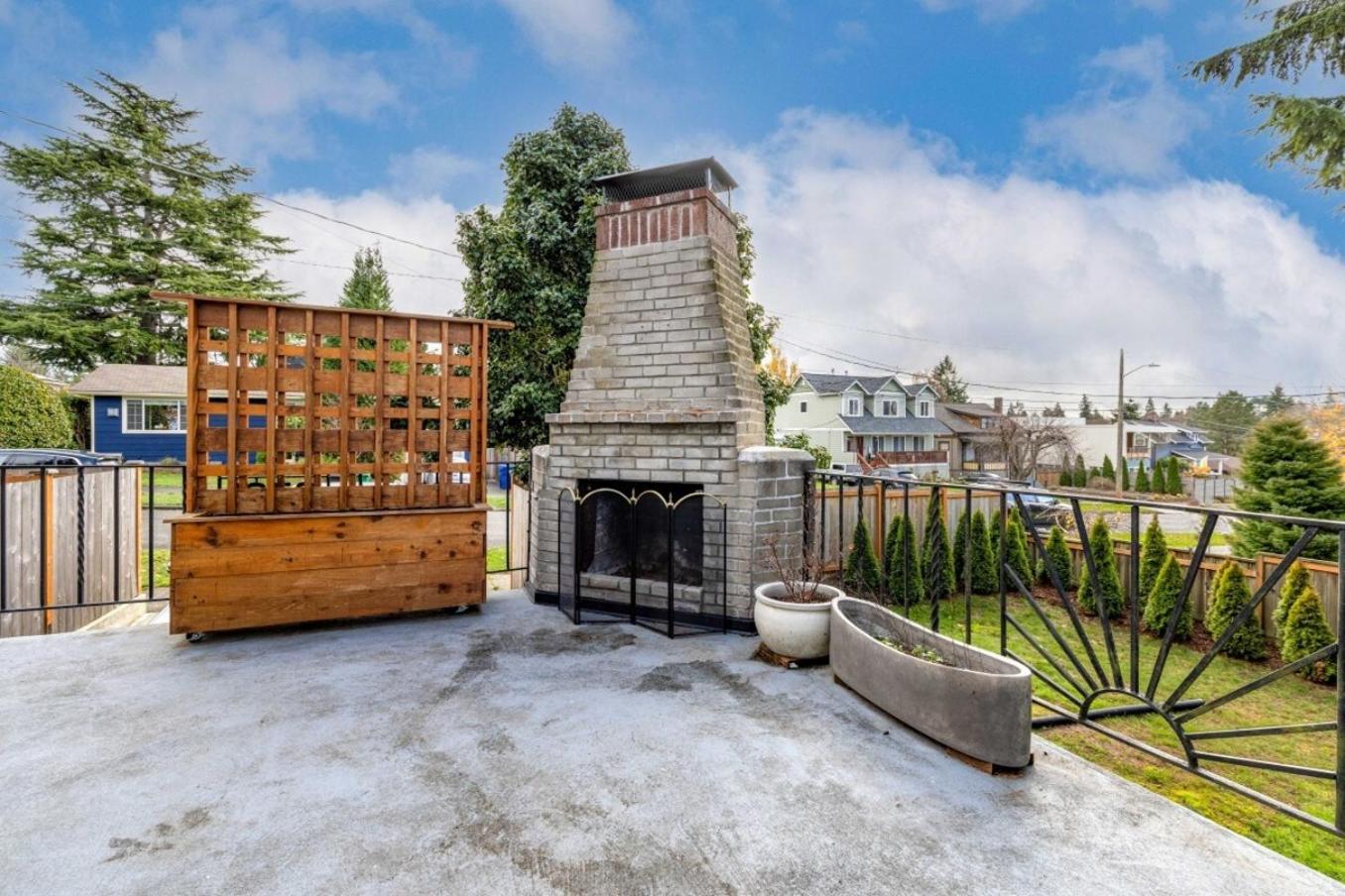 Remodeled Home Fenced Yard Outdoor Fireplace view 2