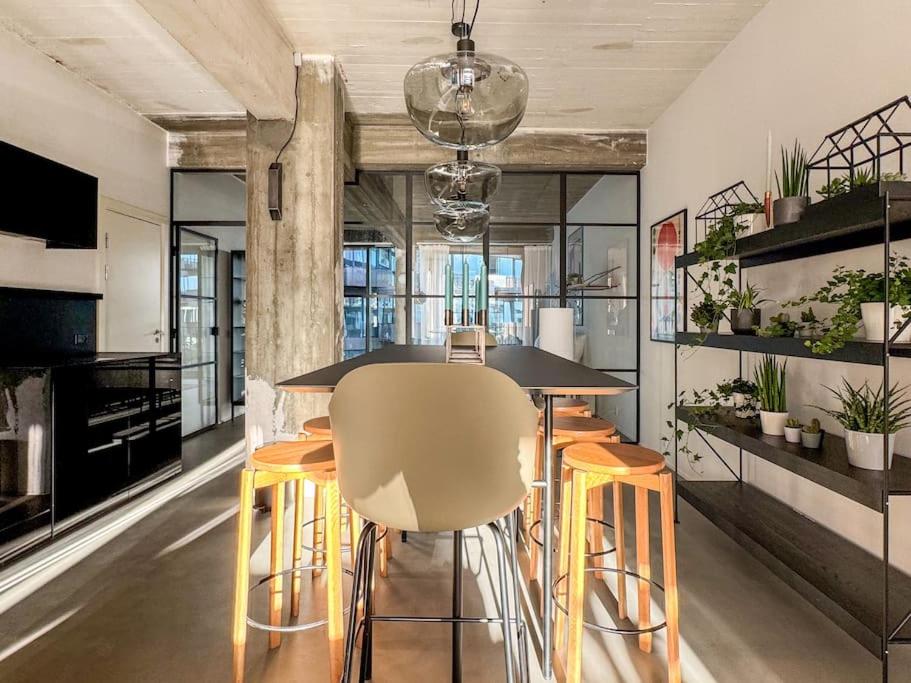 Stunning Industrial-Style Loft by the Canals