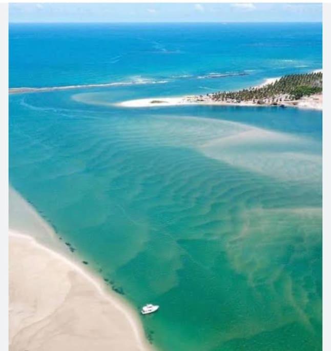 Casasveraneio casa top com 3 suítes com ar condicionado a 100 m da Praia - Barra de São Miguel, 7 minutos do gunga e 3 da praia bonita e conchas ! Área gou