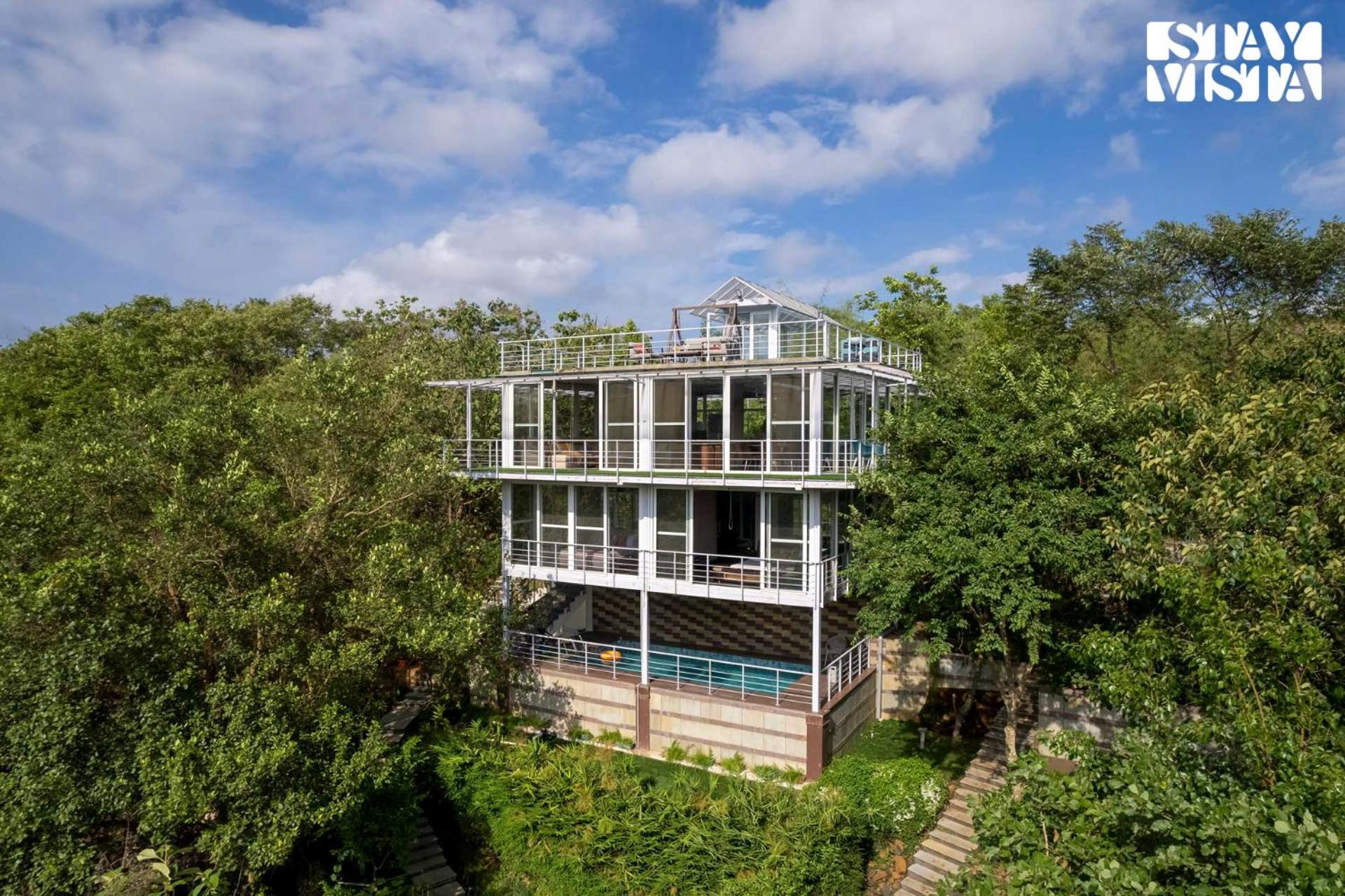The Glasscape by StayVista - Hillside getaway with Pool and Indoor games view 2