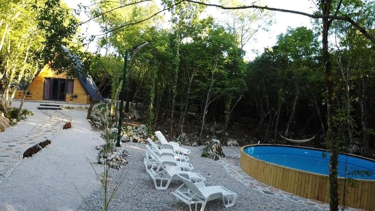 Woodland paradise Charming wooden houses in stone