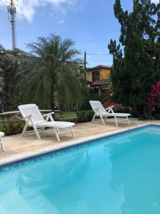 Linda casa com piscina à 3min da Praia caminhando