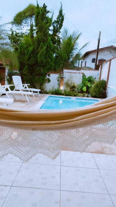 Linda casa com piscina à 3min da Praia caminhando