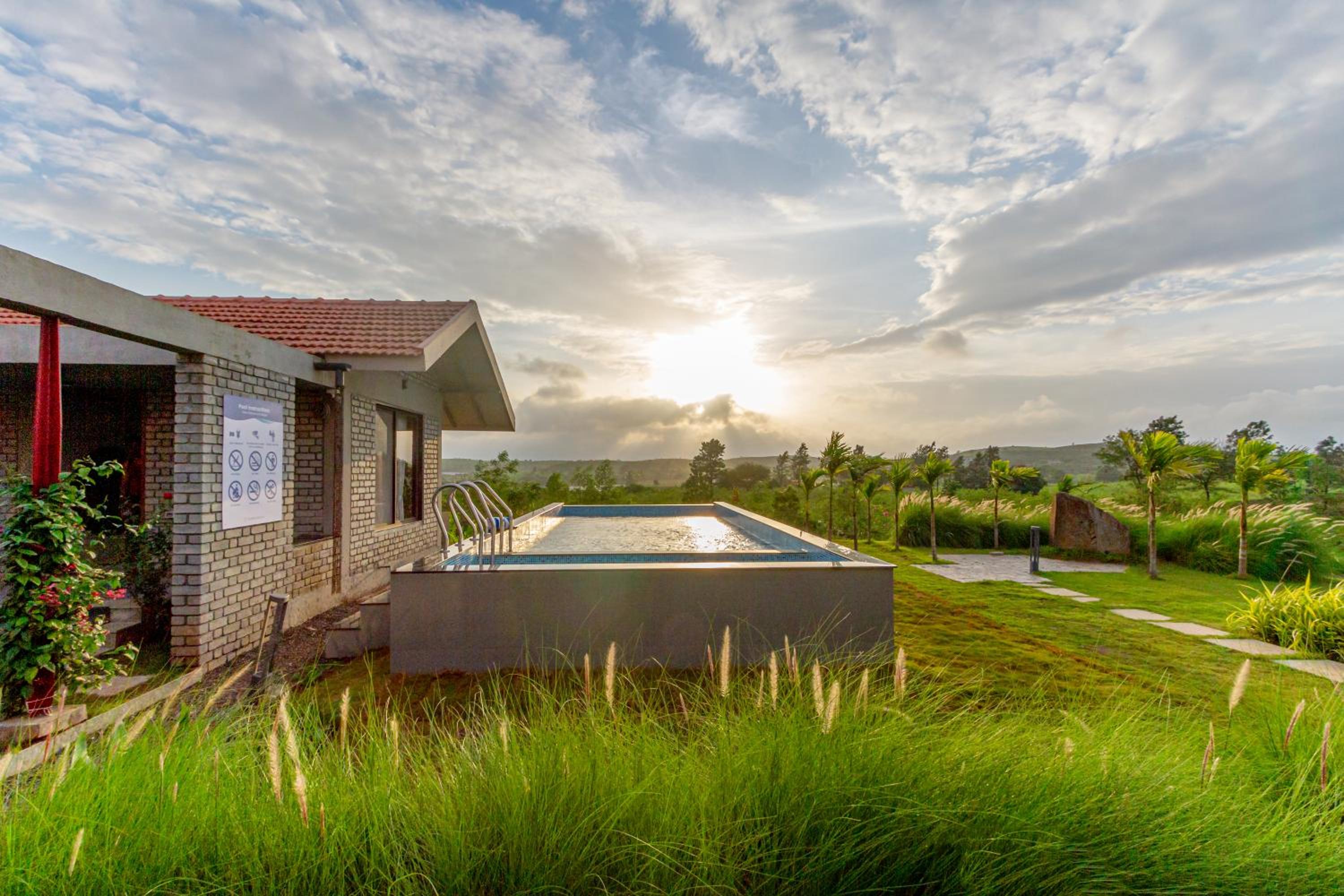 SaffronStays Ashfield - 5BHK Eco-Farmhouse with Pools, Jacuzzi, Lawn & Games Room view 2