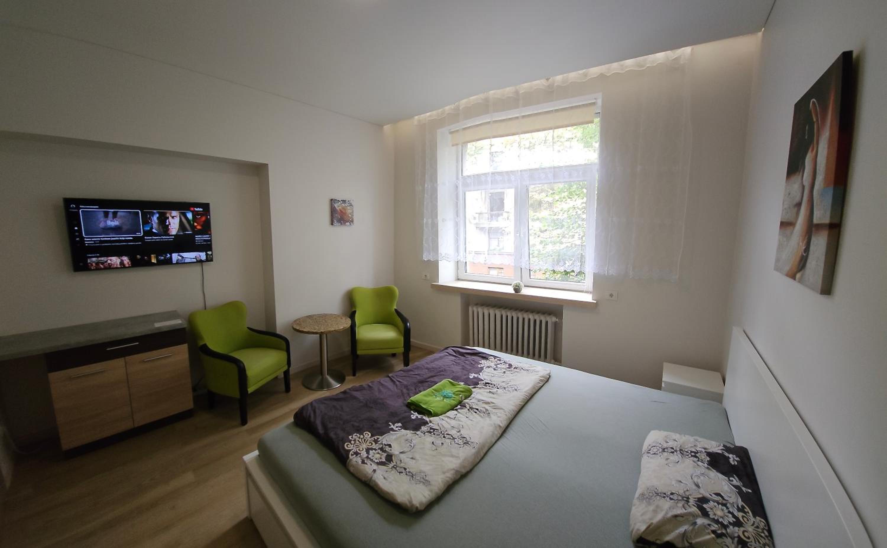 Kauno apartamentai king size bed view 5