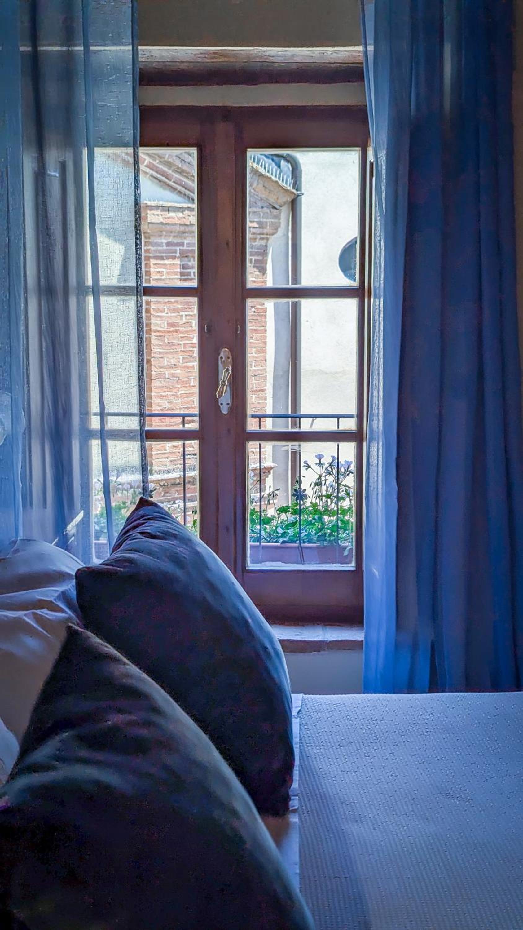 Pienzalettings Suites en Pienza — bedroom