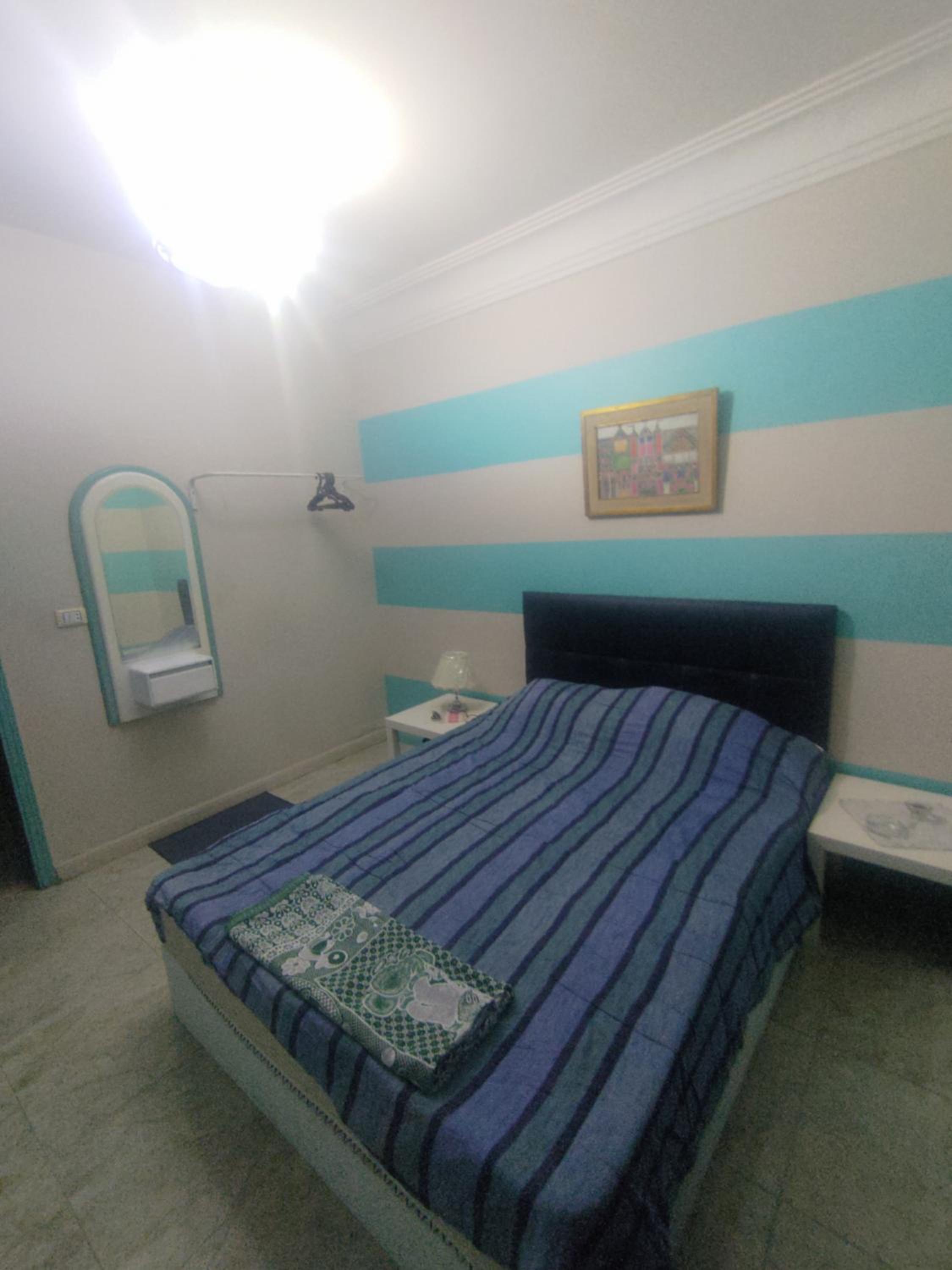 Cairo Gem budget room with AC and smart TV, 12minutes from the airport please only book through booking we can't offer booking outside the app, please cont
