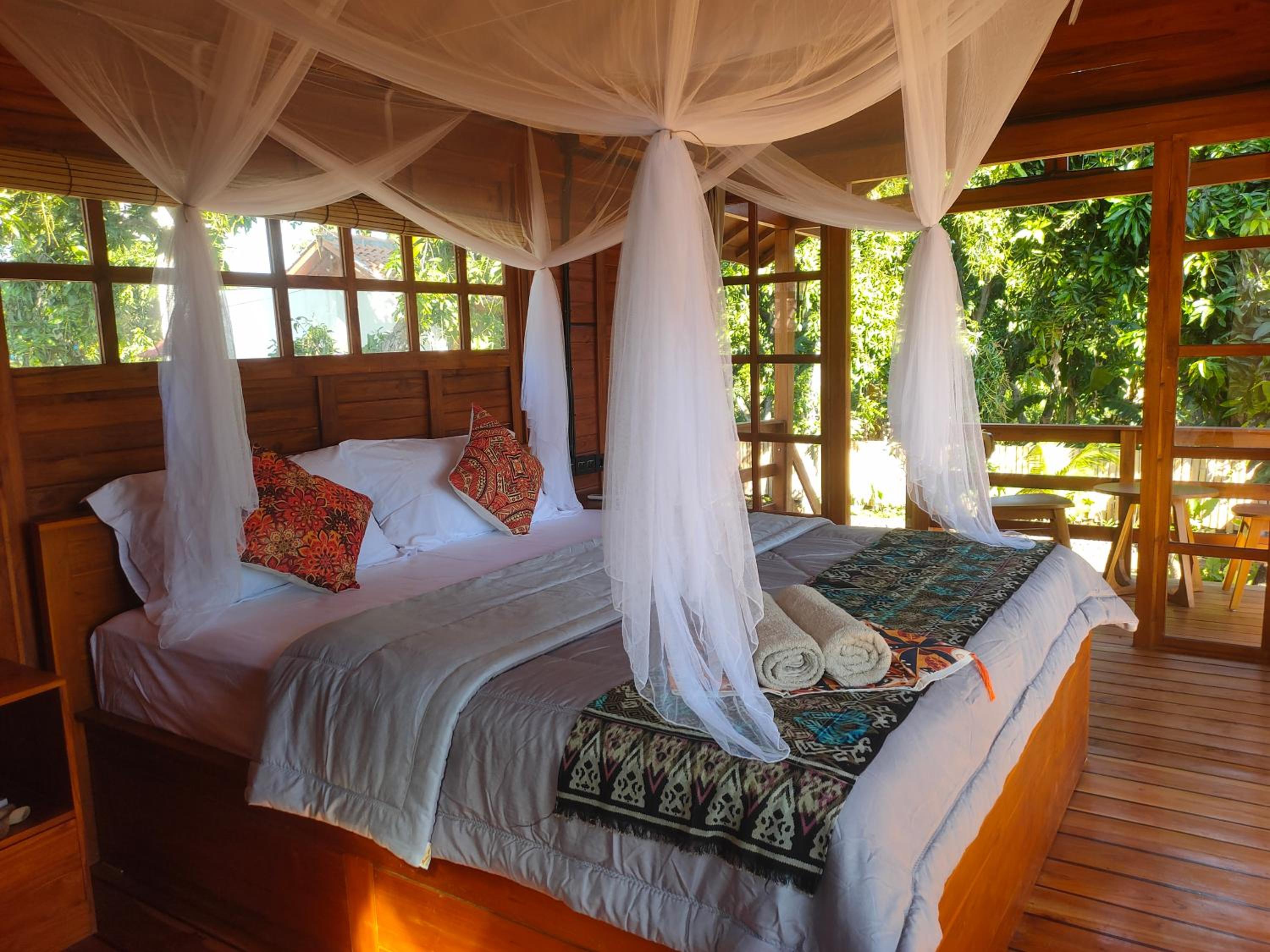 VANAYA wooden Lodges in Lush Garden view 3