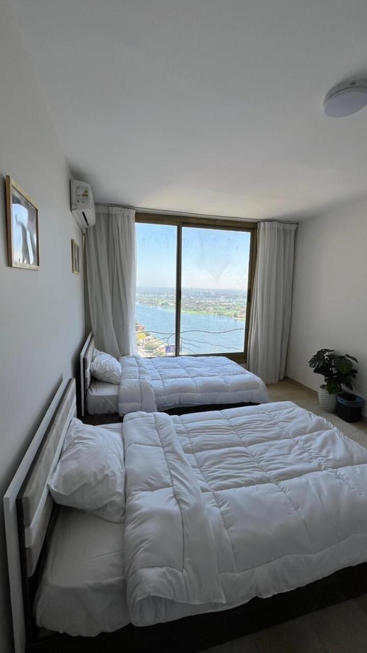 Nile and pyramids view 4BR apt