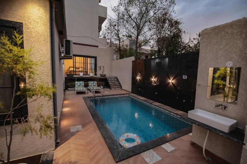 Saiba OutHouse- 4 Bed room- Pool- Theatre- PartyHall- Garden & Terrace sitting area view 2