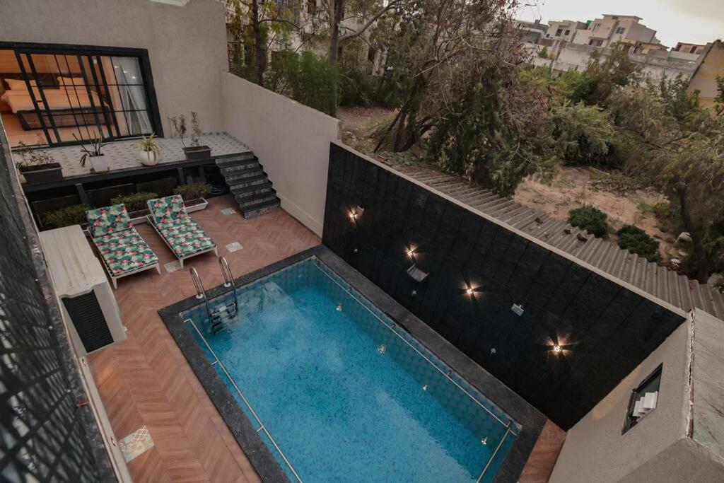 Saiba OutHouse- 4 Bed room- Pool- Theatre- PartyHall- Garden & Terrace sitting area view 4