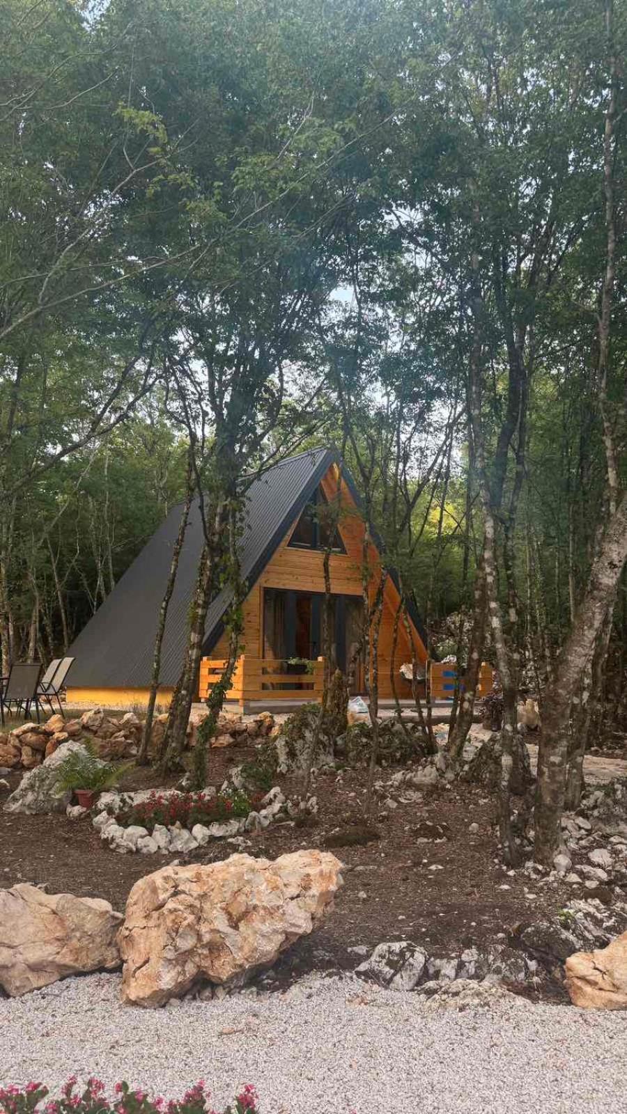 Woodland paradise Charming wooden houses in stone