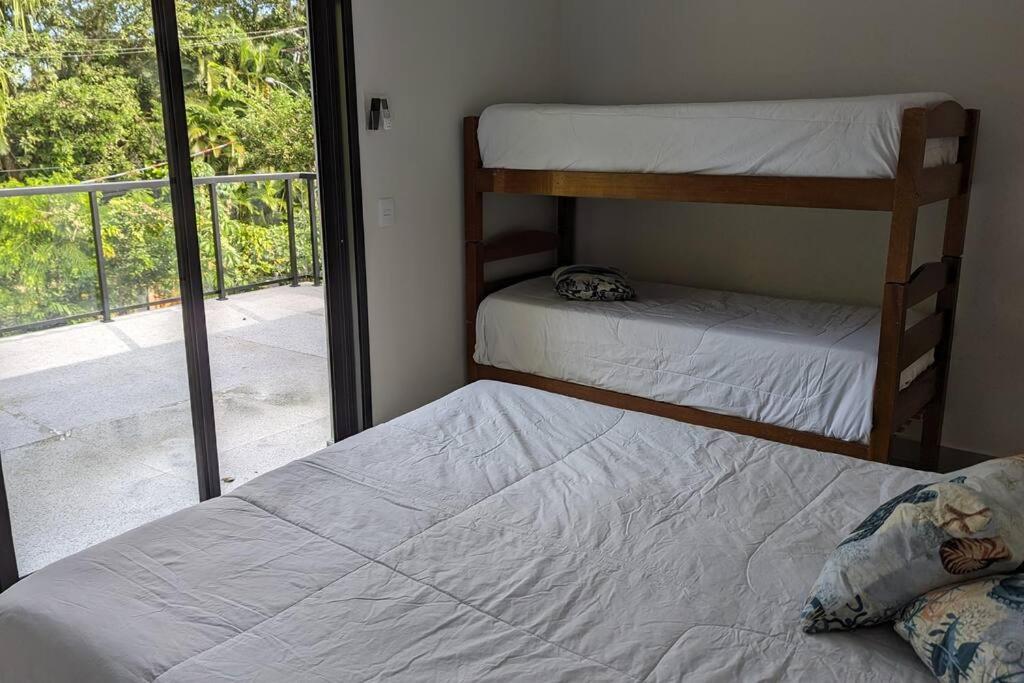 50m praia Cond pé na areia Alto padrao 4 suites Segur 24h Costa do sol Guaratuba Bertioga prox Riviera