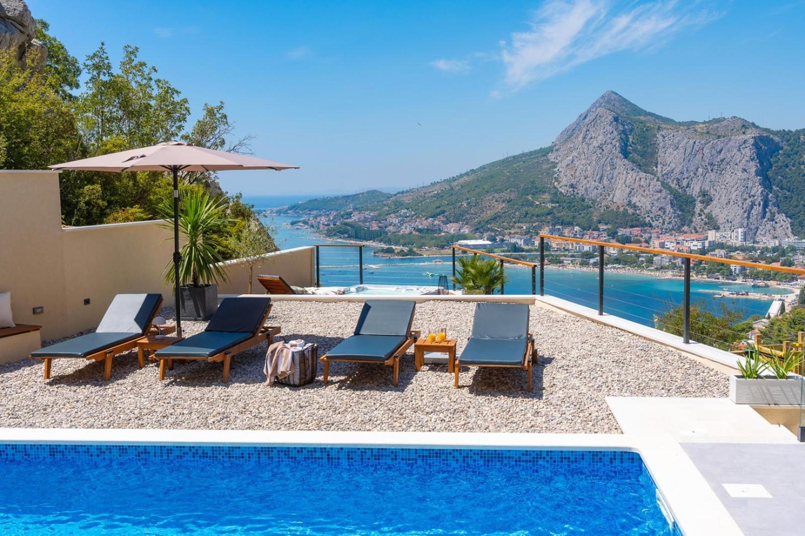 Casa Vita featuring a sea view, billiards, and heated pool view 4