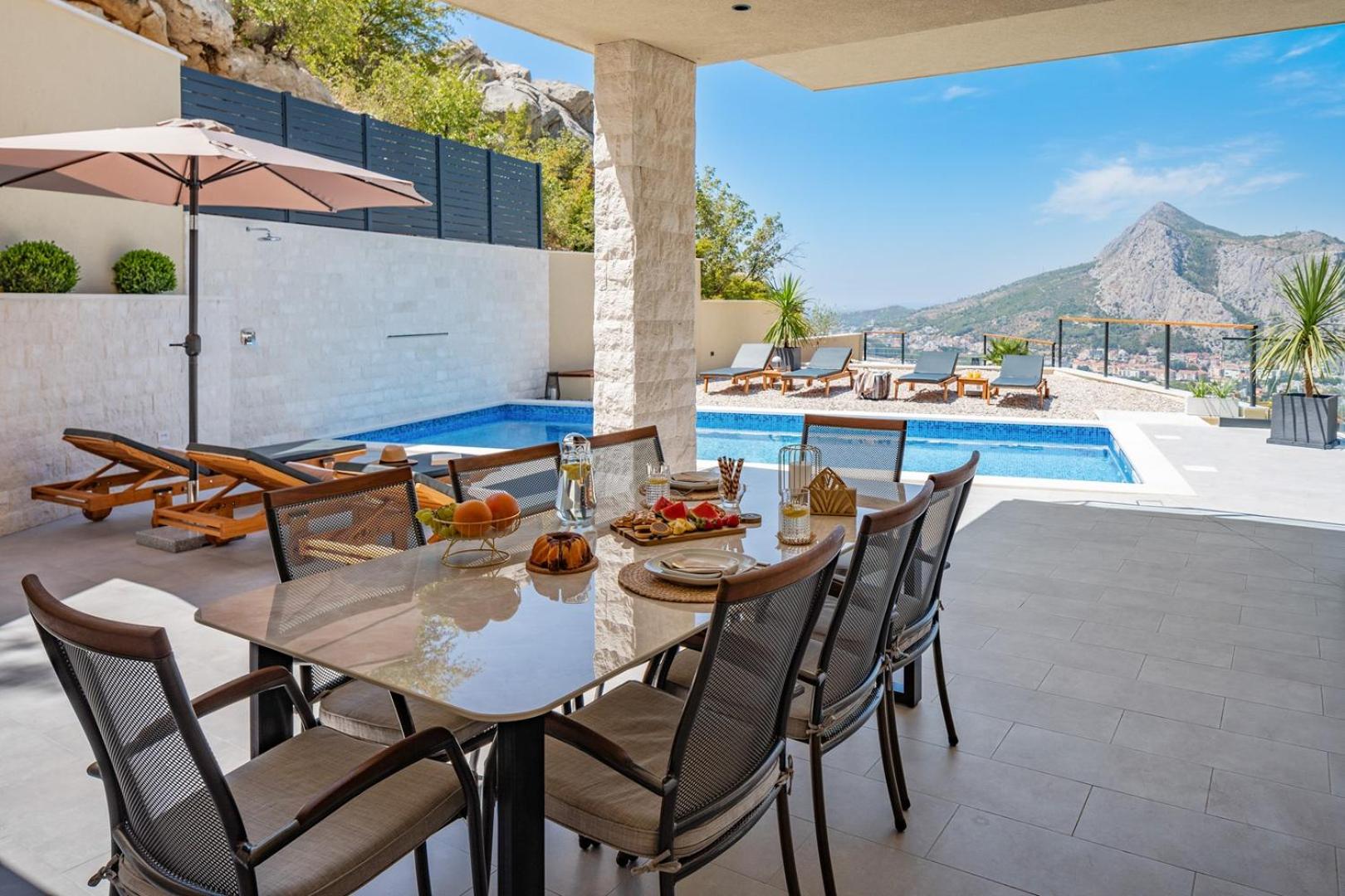 Casa Vita featuring a sea view, billiards, and heated pool view 3