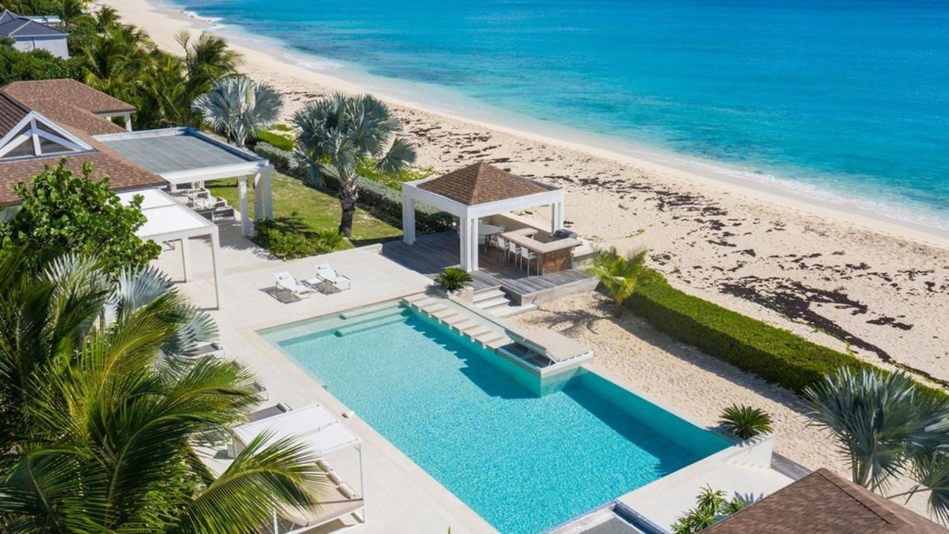 Deluxe 4BR beachfront villa with sunset views