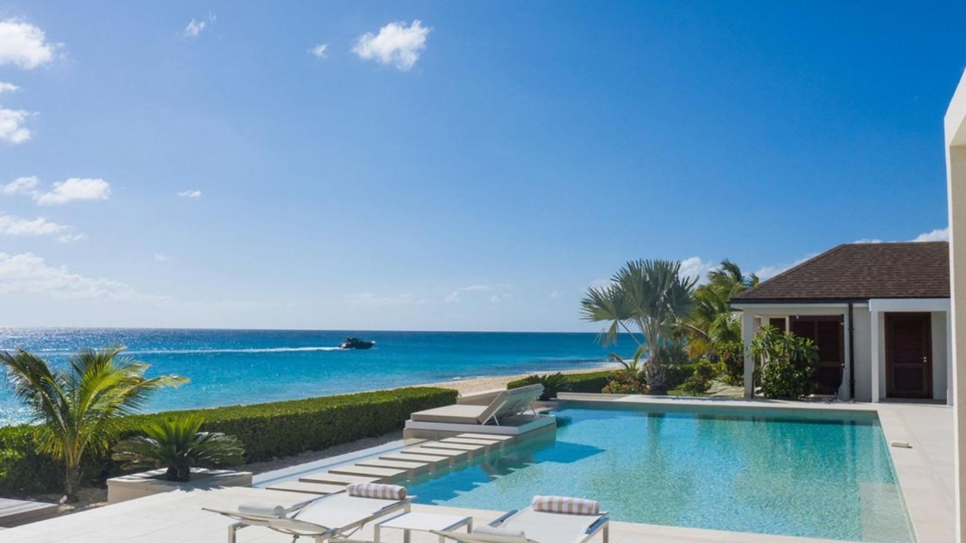 Deluxe 4BR beachfront villa with sunset views