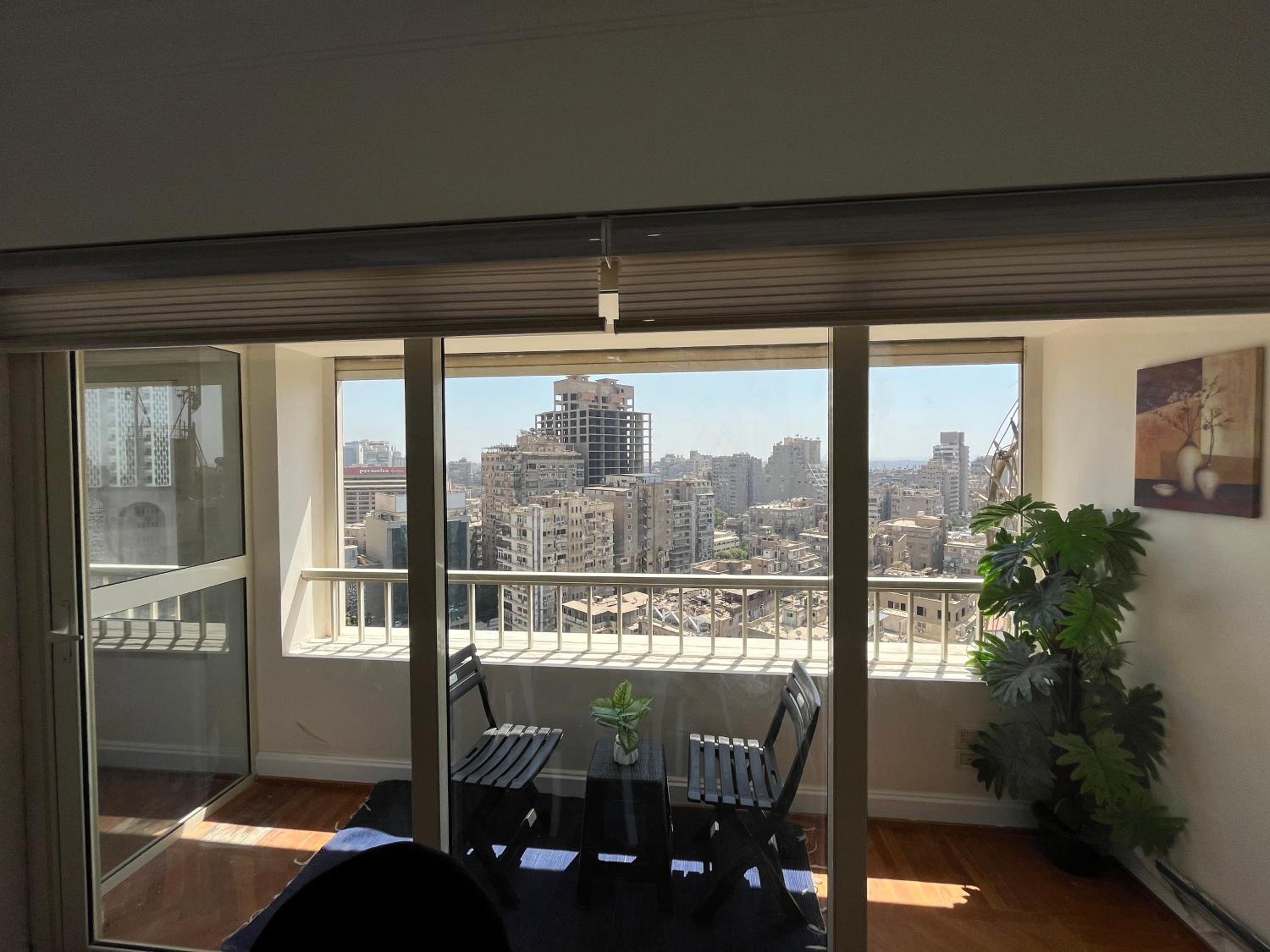 Skyscraper apartment with Nile & Pyramids view