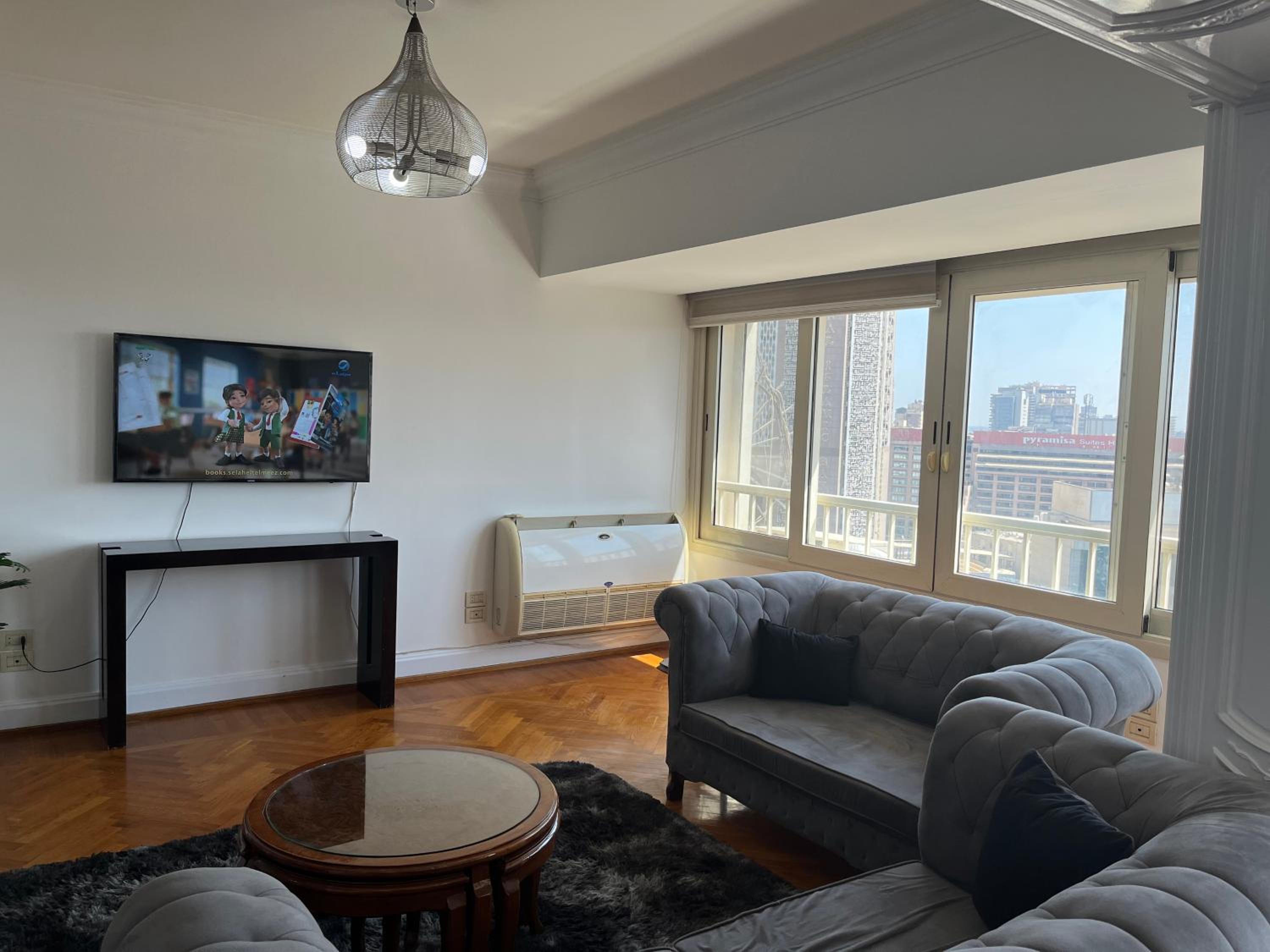 Skyscraper apartment with Nile & Pyramids view
