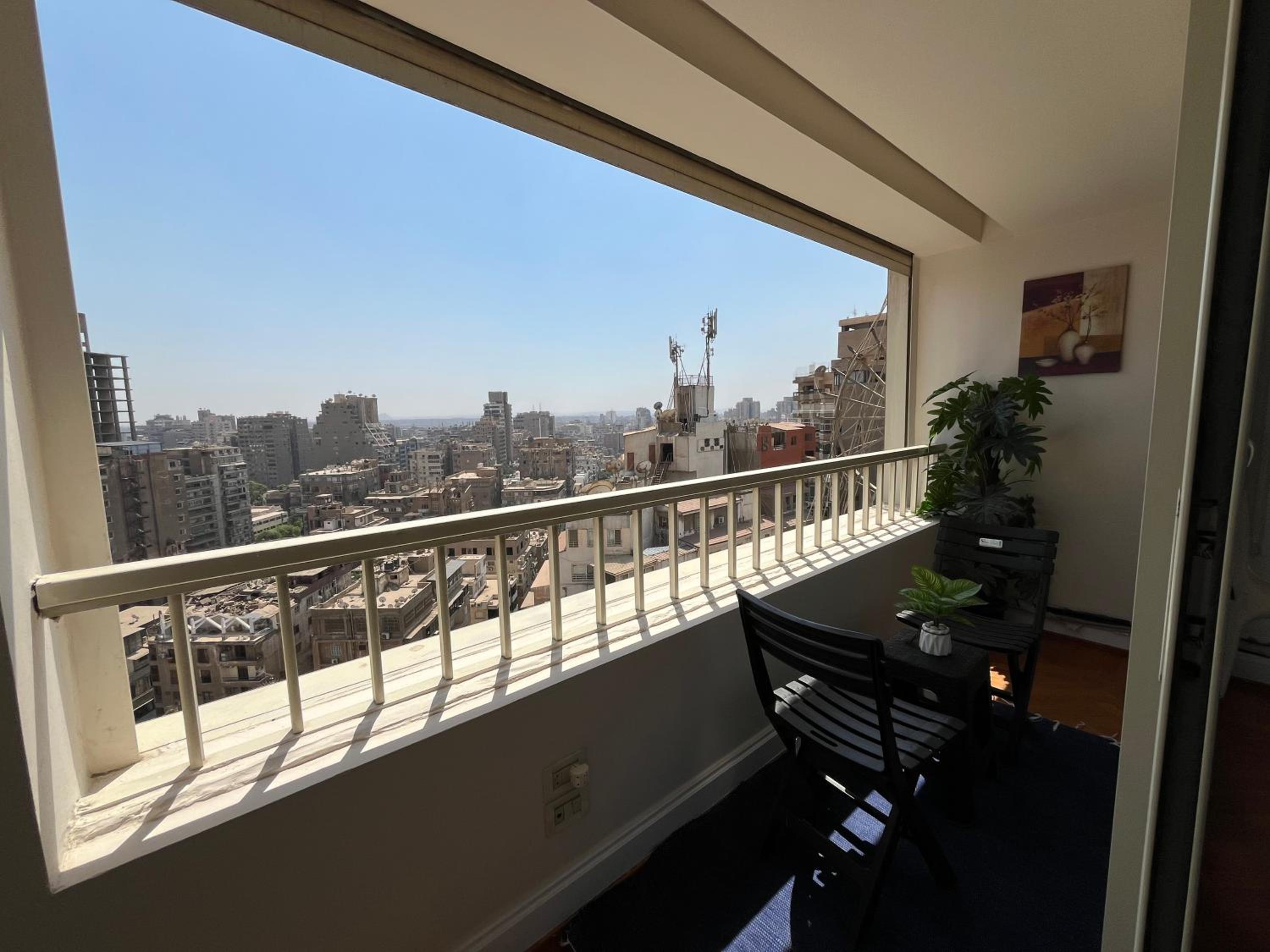 Skyscraper apartment with Nile & Pyramids view