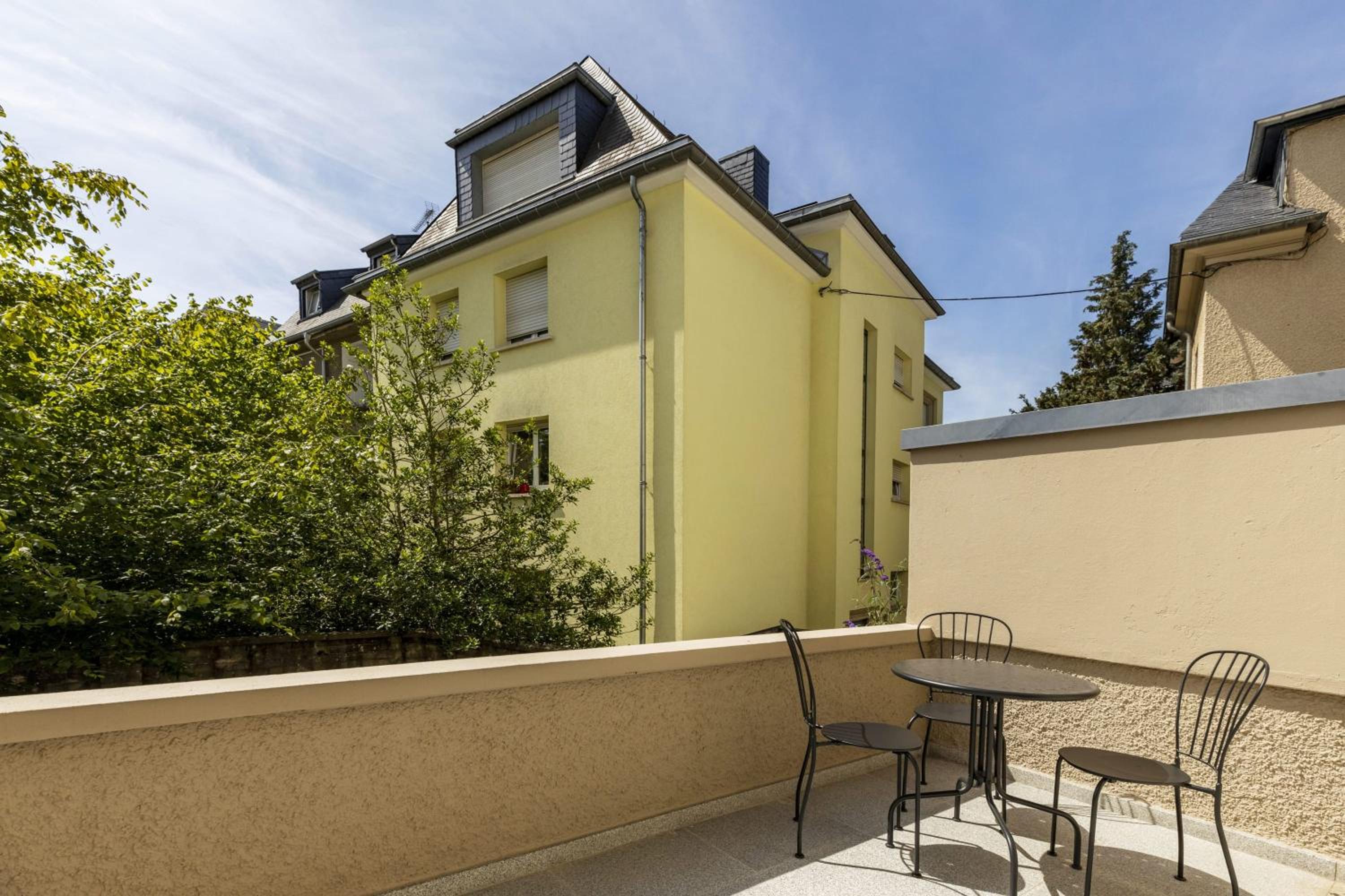 Elegant 1BR Retreat with Patio Near Kirchberg view 4