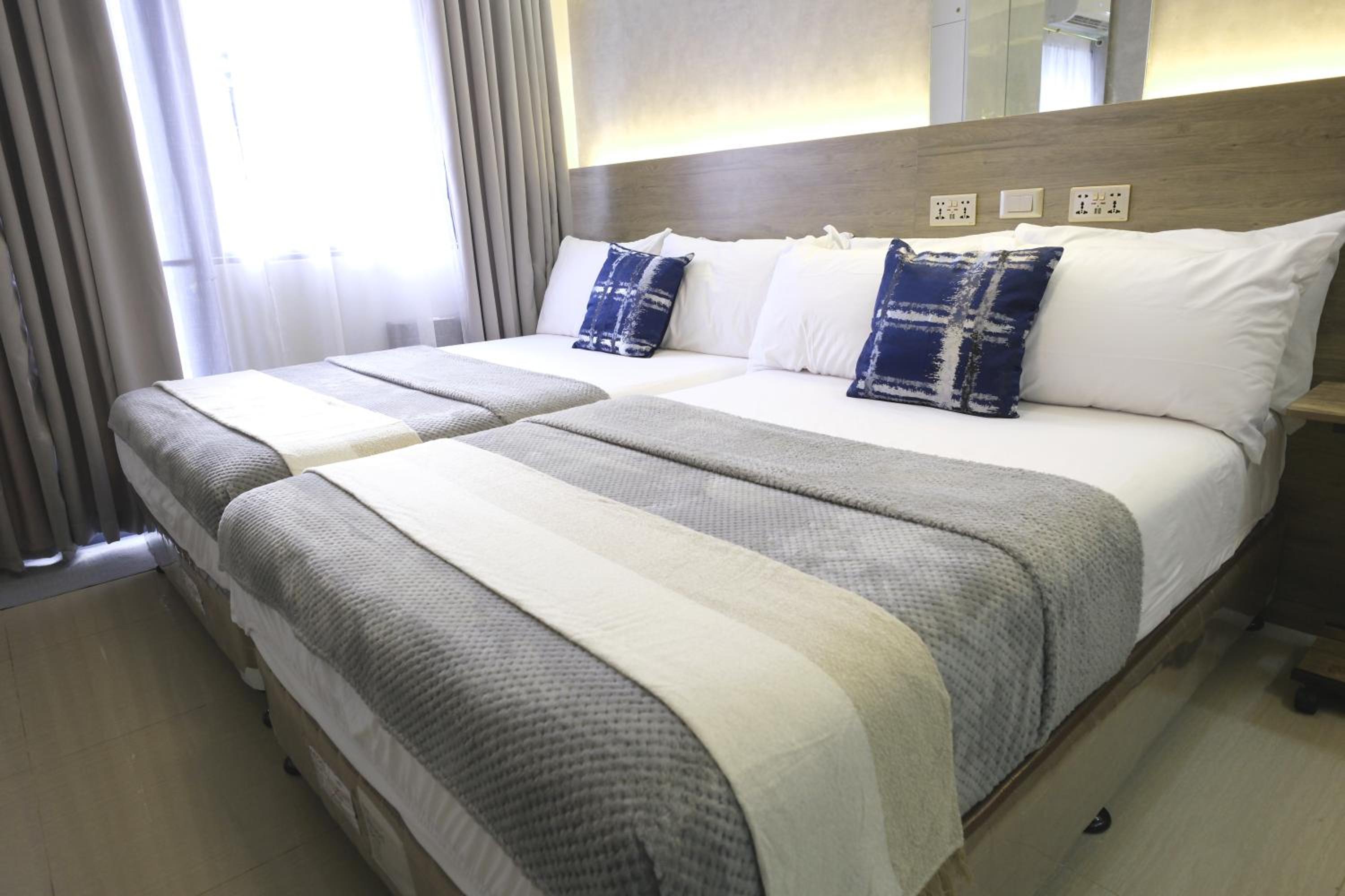 Stylish Studio Condotel with 2 Beds near Mall of Asia & Airport - JWL Suites