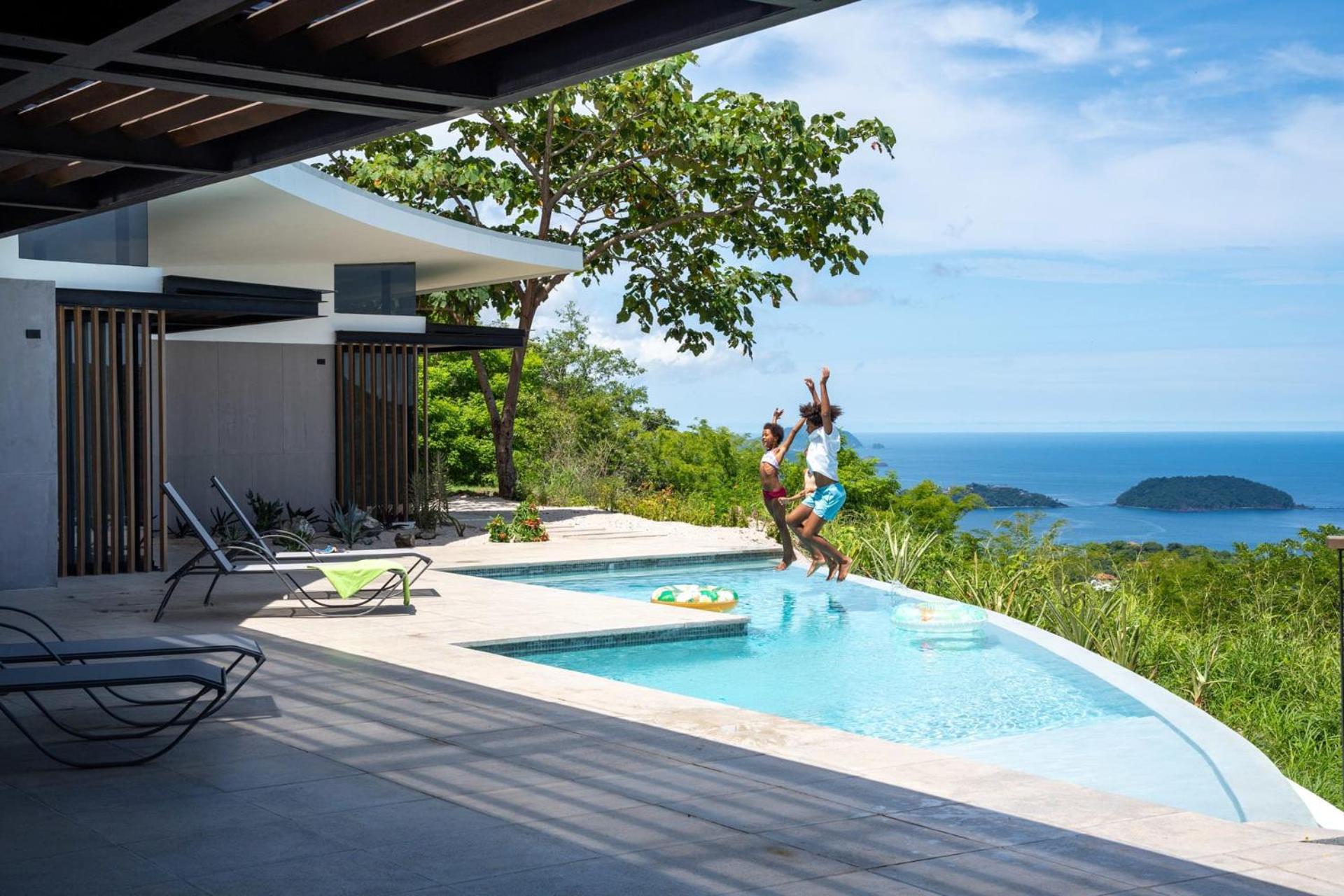 Luxurious Ultramodern Property with Private Suites, Infinity Pool, and Sweeping Ocean and Mountain Views