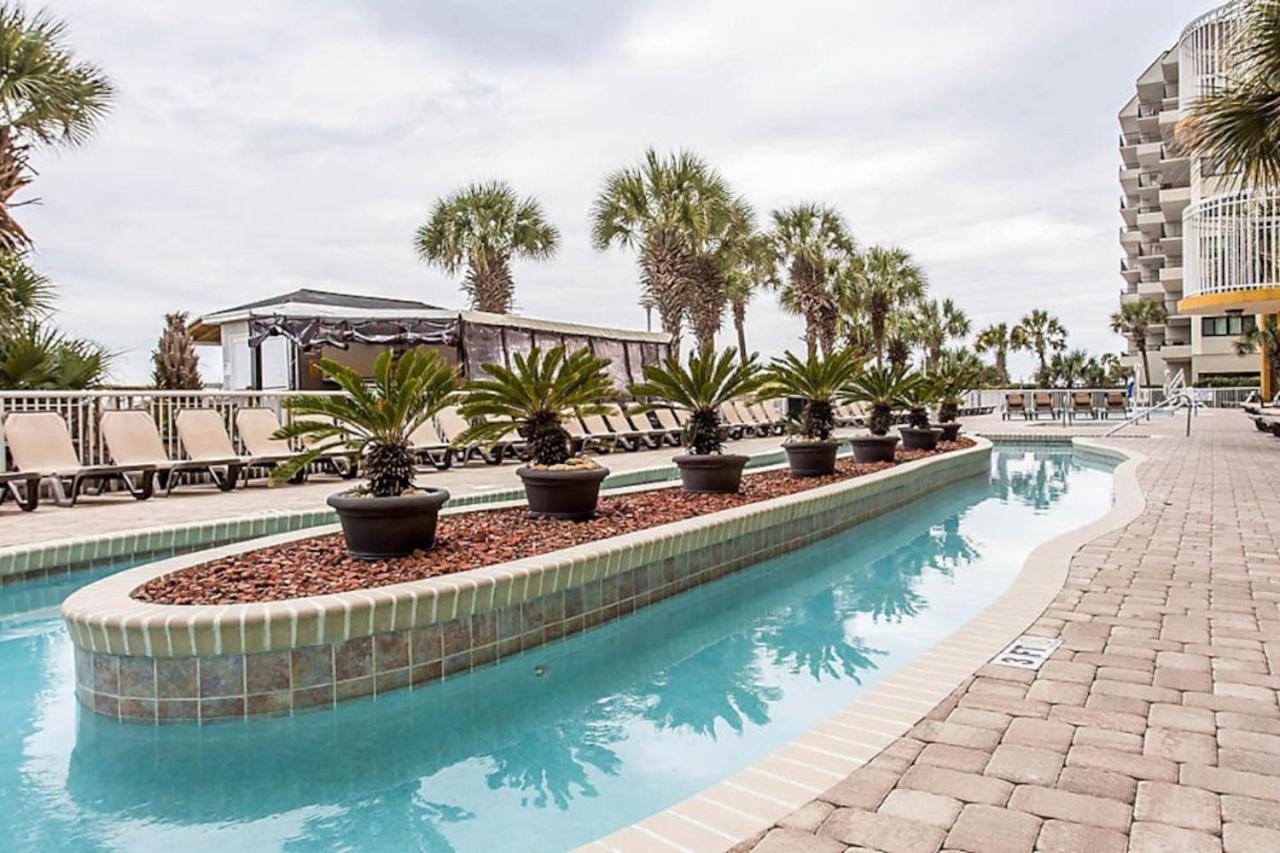 Beach themed 1BD condo with resort amenities including lazy river
