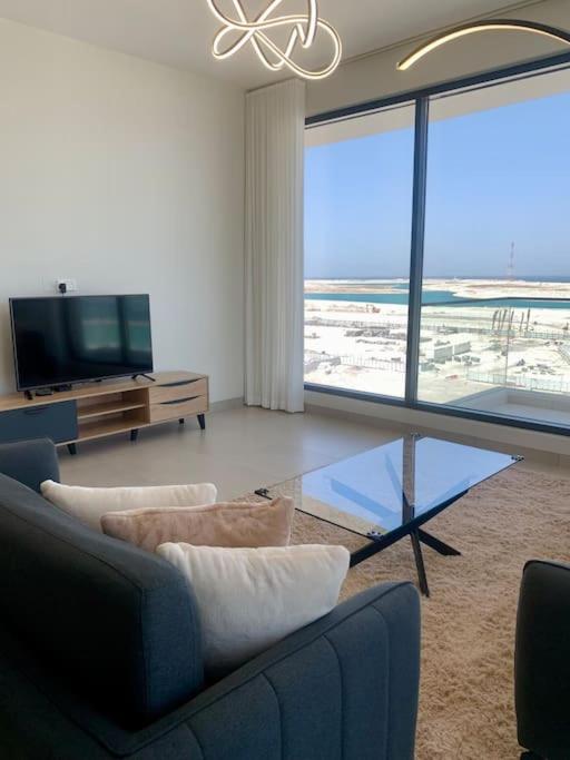 Elegant 3 BR APT footsteps from a mall & a beach