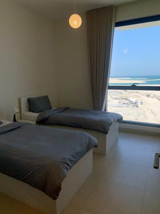 Elegant 3 BR APT footsteps from a mall & a beach