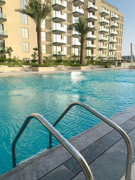 Elegant 3 BR APT footsteps from a mall & a beach