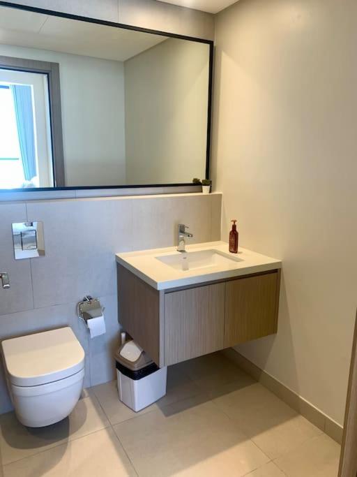 Elegant 3 BR APT footsteps from a mall & a beach