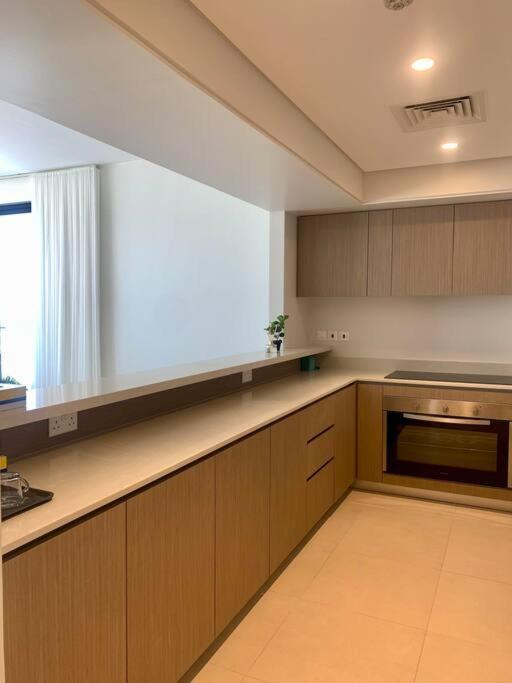 Elegant 3 BR APT footsteps from a mall & a beach