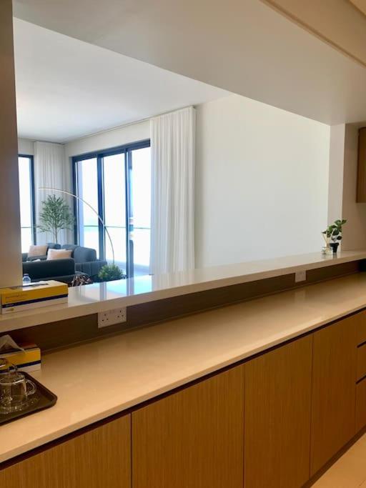 Elegant 3 BR APT footsteps from a mall & a beach