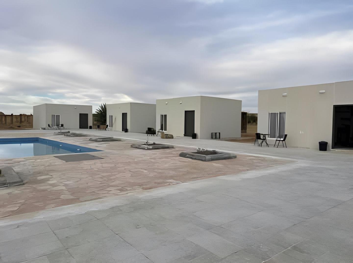Studio overlooking pool amid flowering and quiet