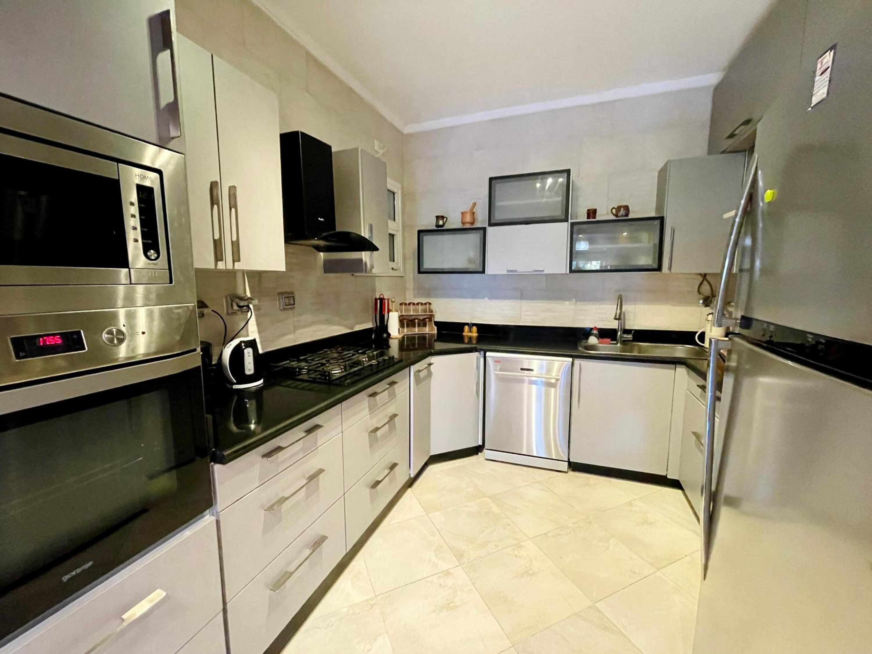 2BR Apartment with Private Garden in Downtown Rehab Near Malls