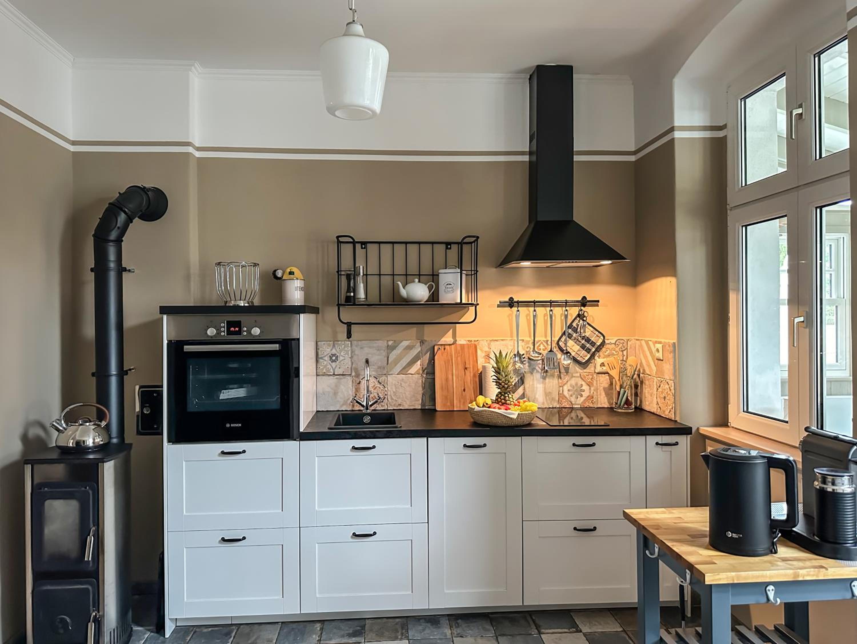Landhaus hinter`m See Ferienwohnung Landliebe luxuriöser Wintergarten Kachelöfen