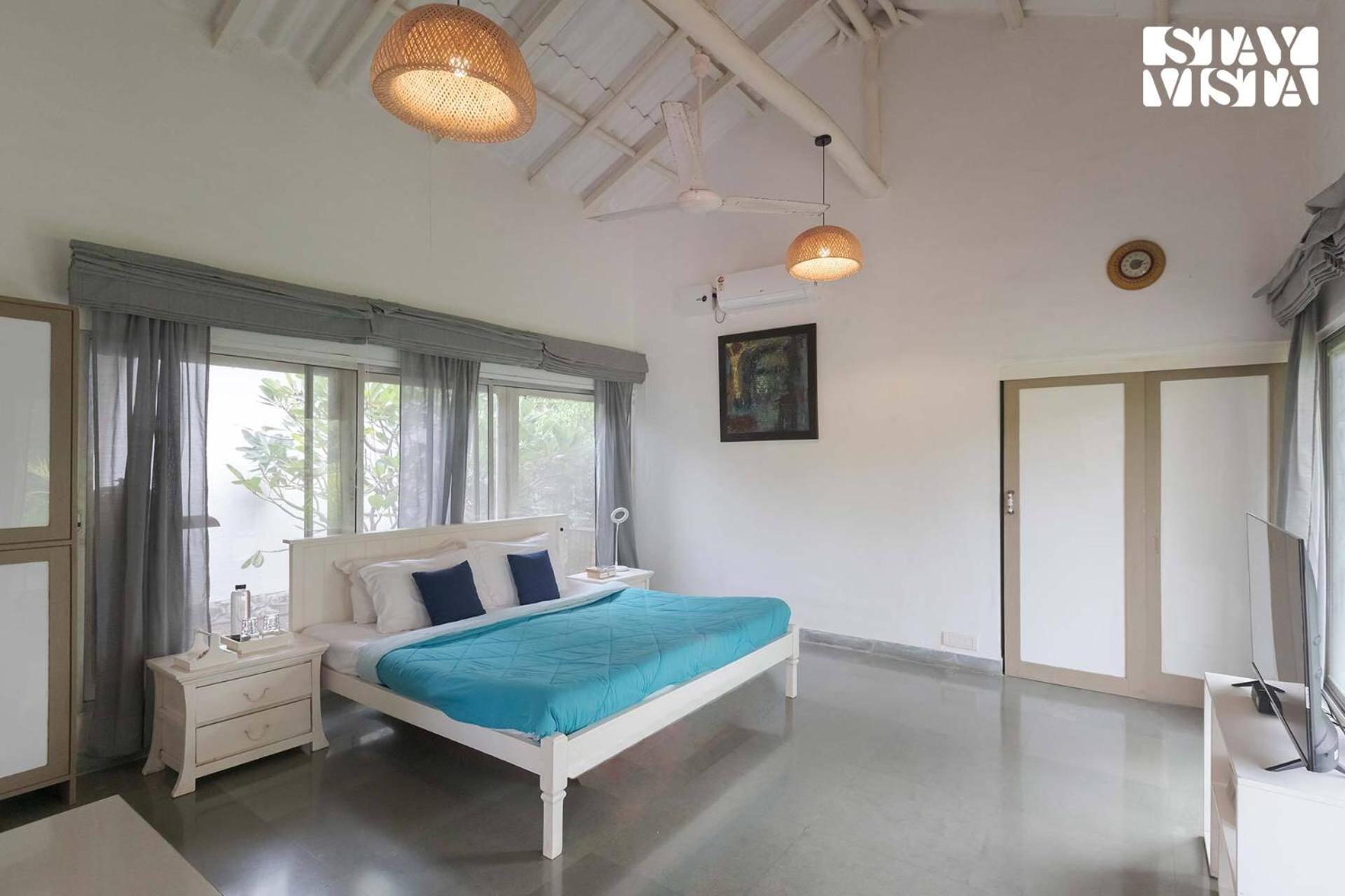 StayVista's Moonlit Trails - Pool-View Villa with Turf Near Mandwa Jetty view 5