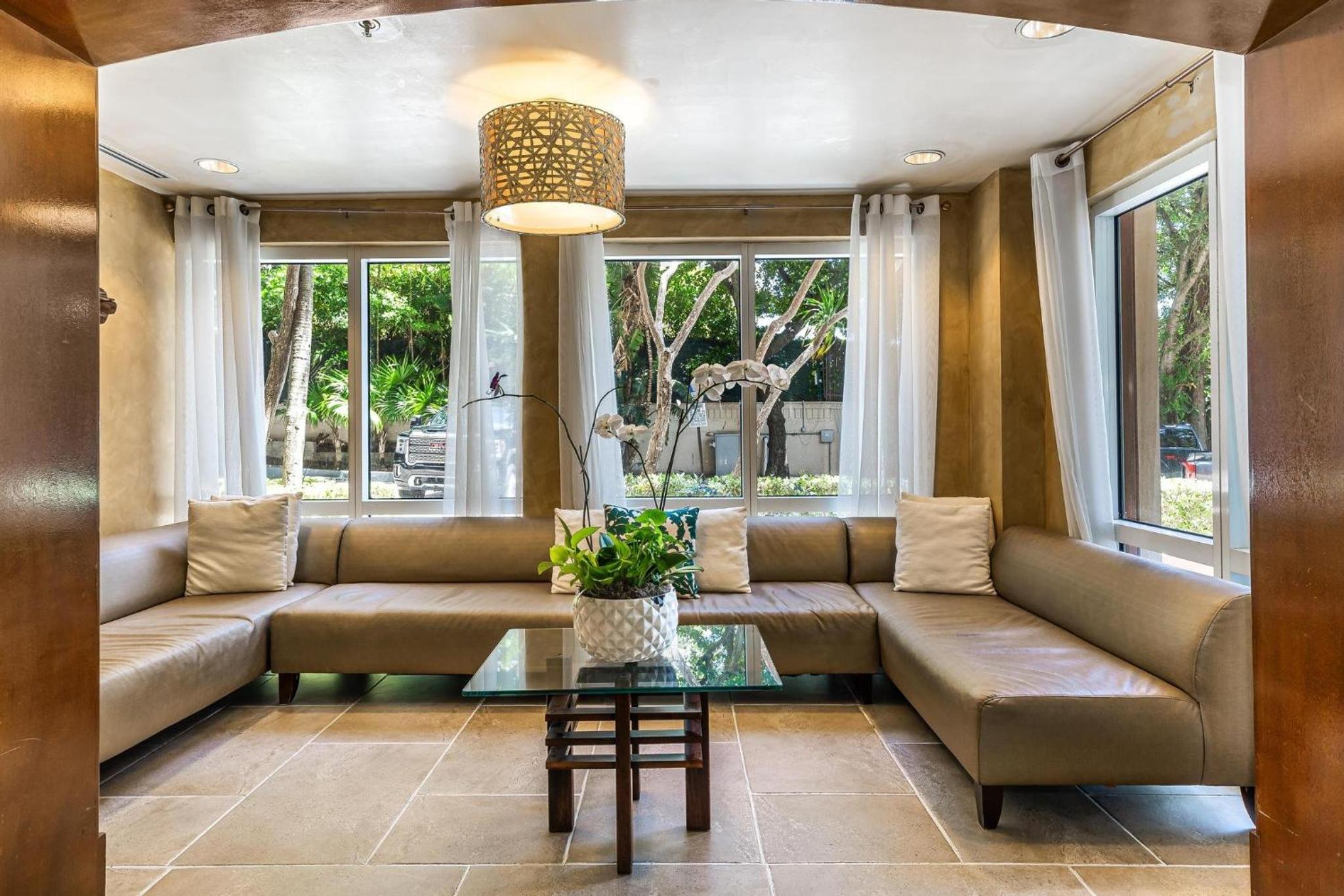 The Palms Coconut Grove 1 bedroom condo includes parking